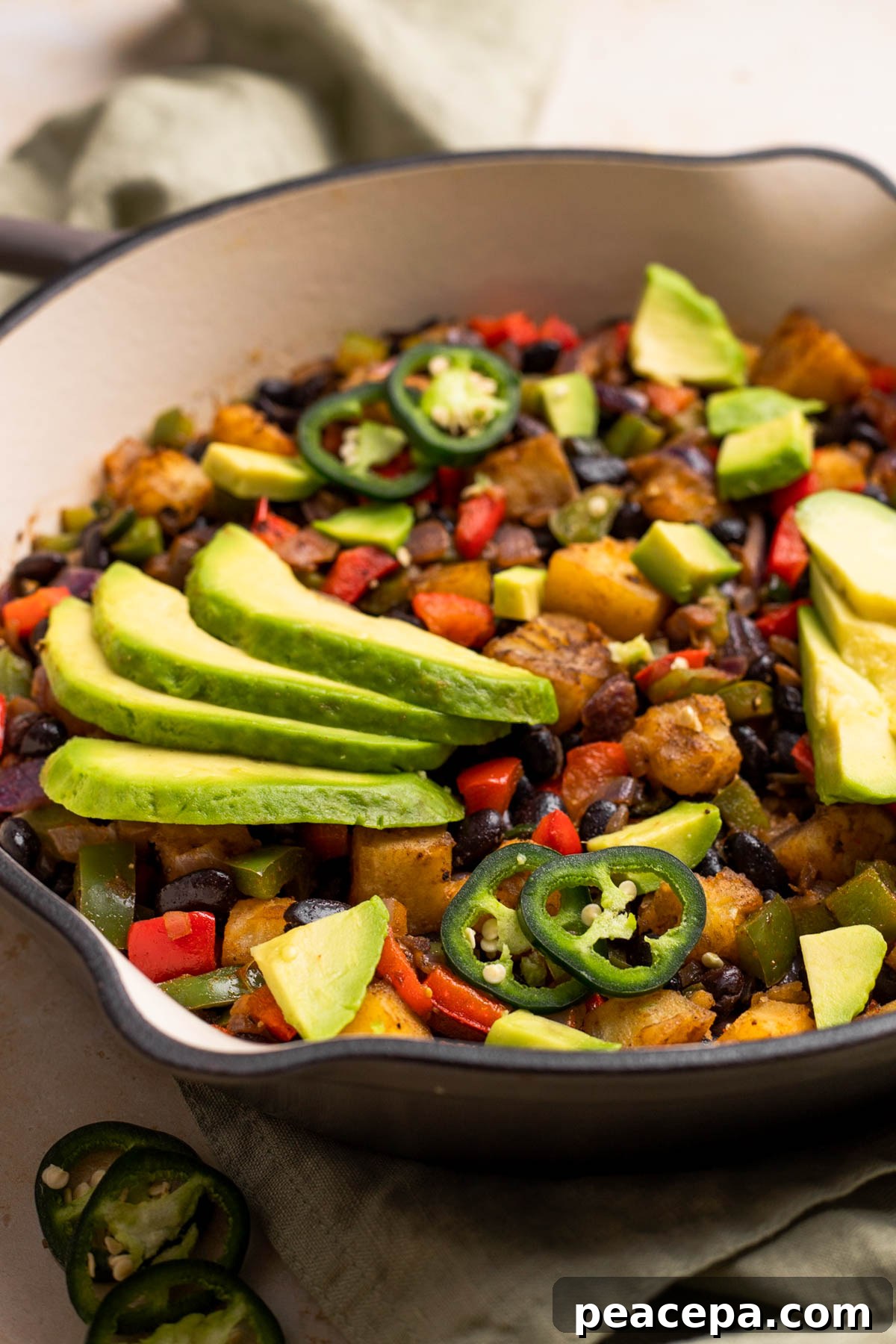 side view of sweet potato breakfast hash in skillet