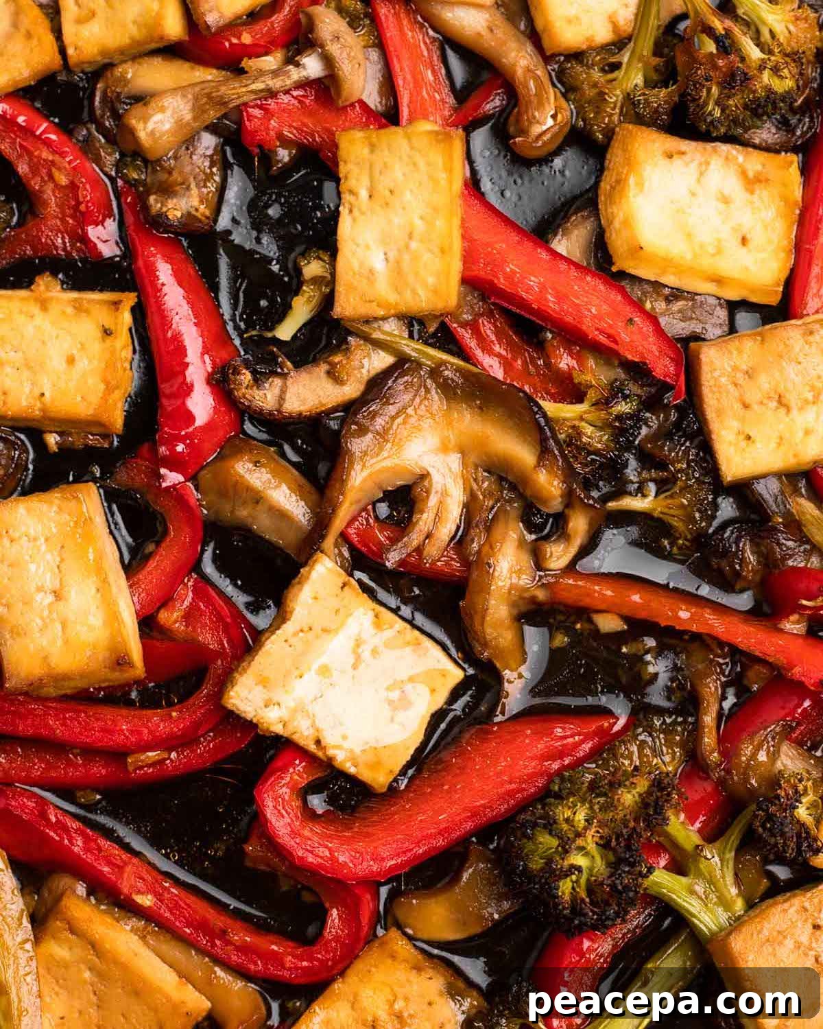 An up-close overhead shot of roasted maple teriyaki tofu & veggies.