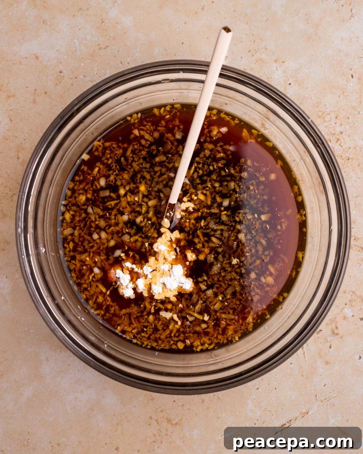 An overhead shot of a mixing bowl of the vegan teriyaki sauce before mixing.