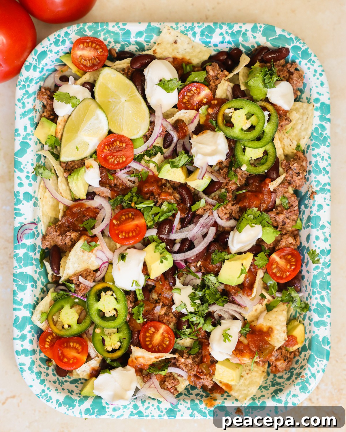 An overhead shot of a tray of vegan nachos.