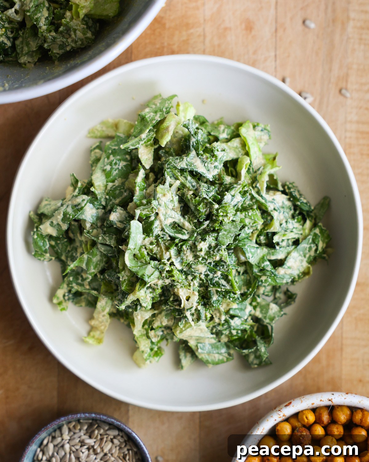 overhead of caesar salad on white plate