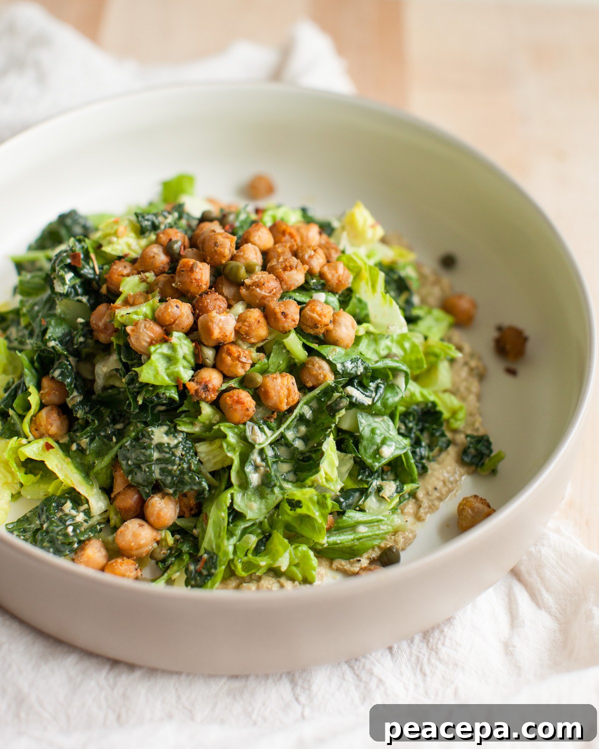 vegan caesar salad topped with crispy chickpeas
