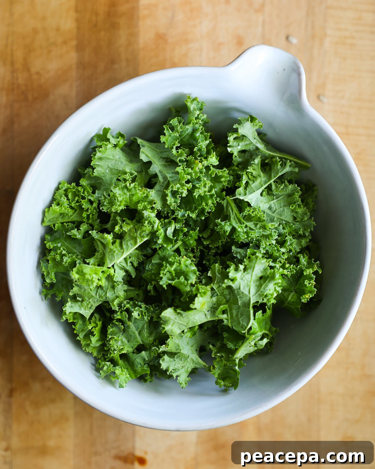 kale in a white salad bowl
