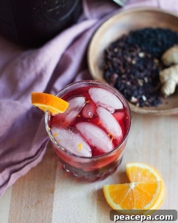 Glass of hibiscus elderberry ginger tea