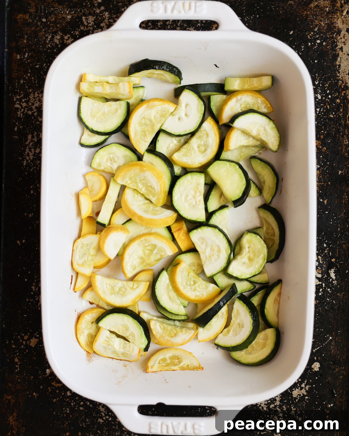 roasted summer squash in white baking dish