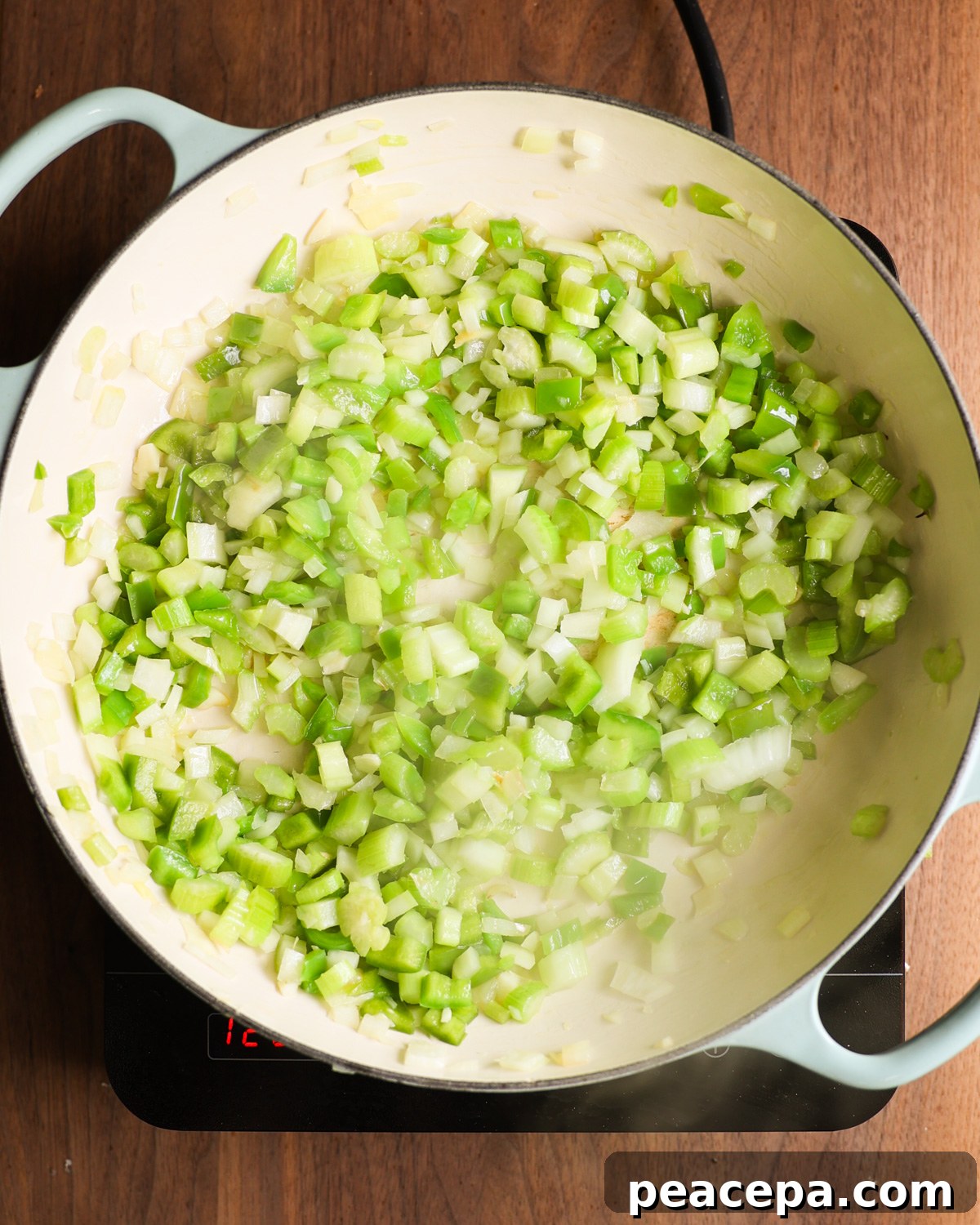 overhead of holy trinity sautéing in pan