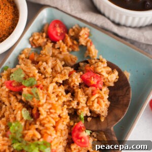 Instant Pot Mexican Rice on a plate with wooden spoon