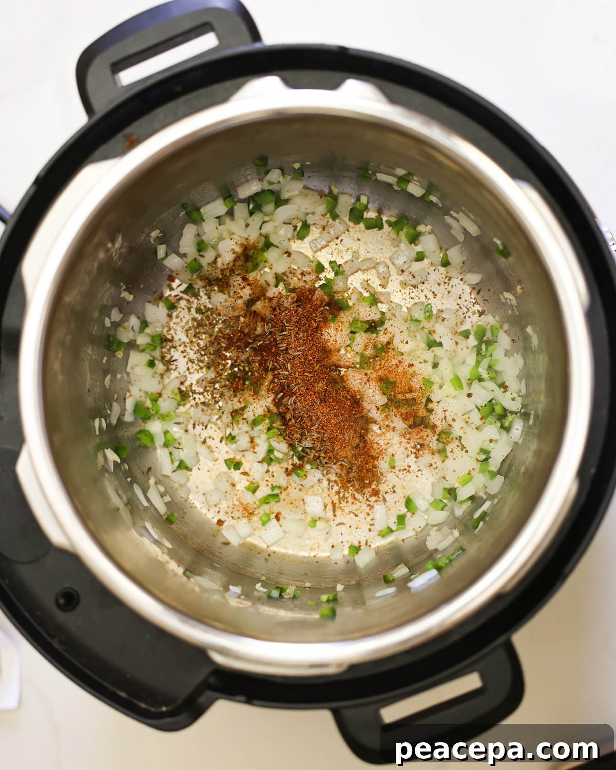 overhead of spices added to instant pot for mexican rice