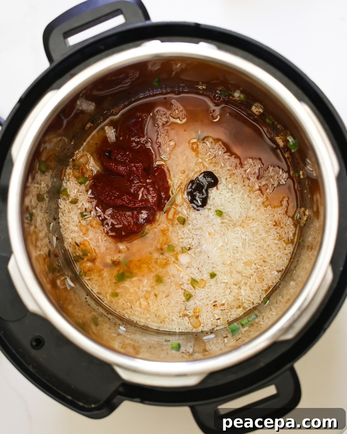 overhead of all ingredients added to instant pot for mexican rice