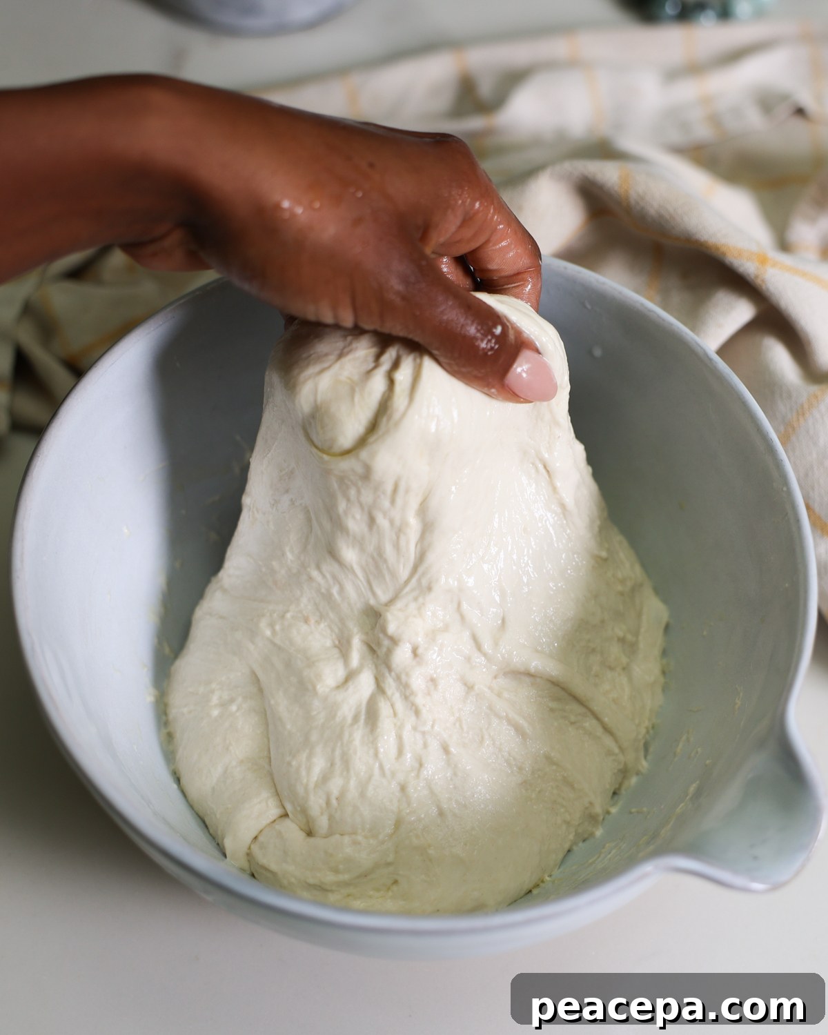 stretching dough to fold