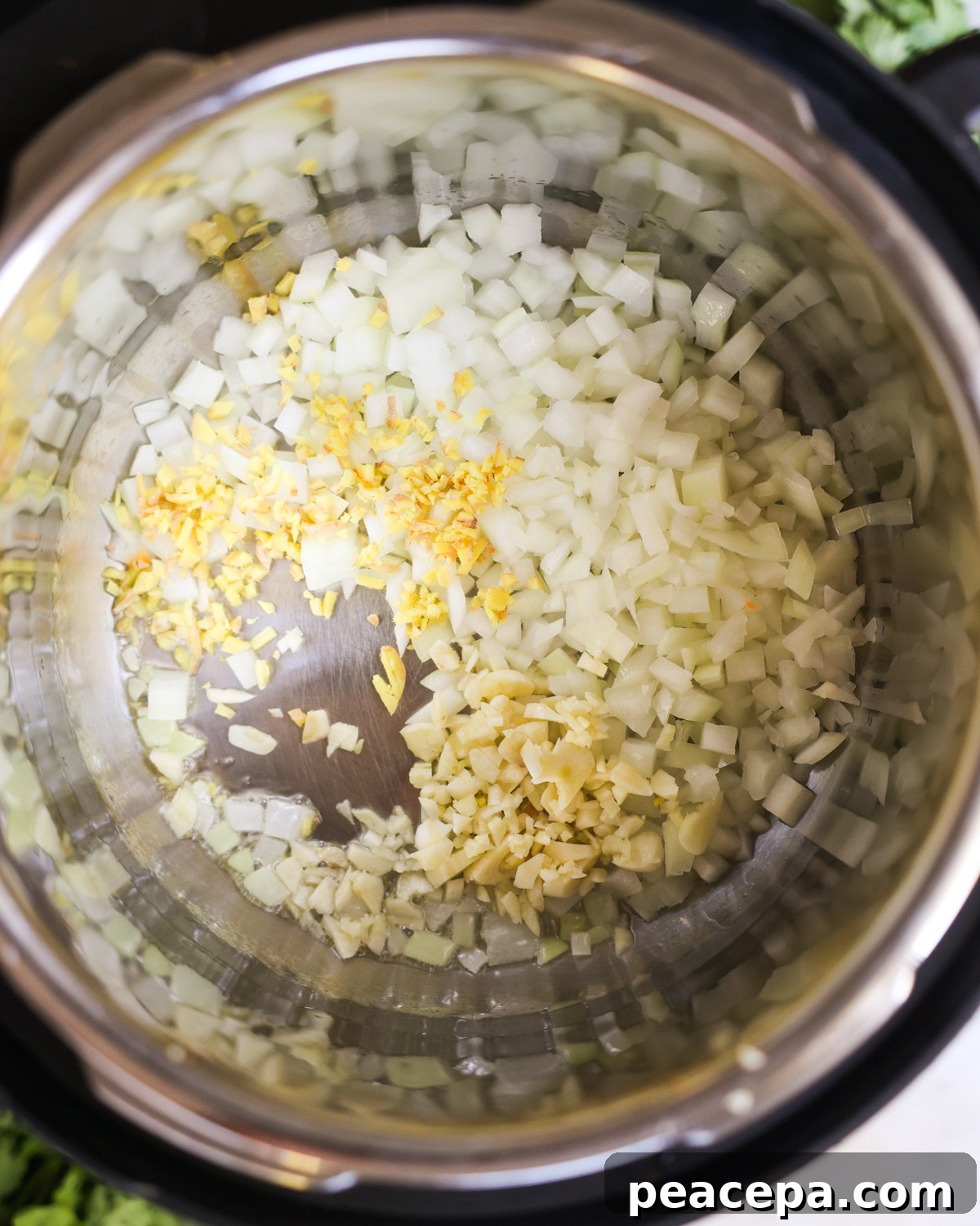 overhead of sautéing aromatics in instant pot