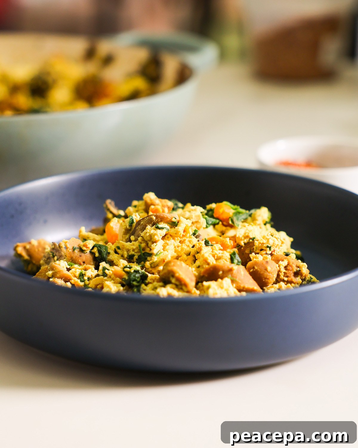 tofu scramble in a blue bowl