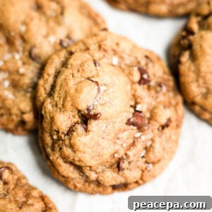 vegan chocolate chip cookie stack on white parchment paper