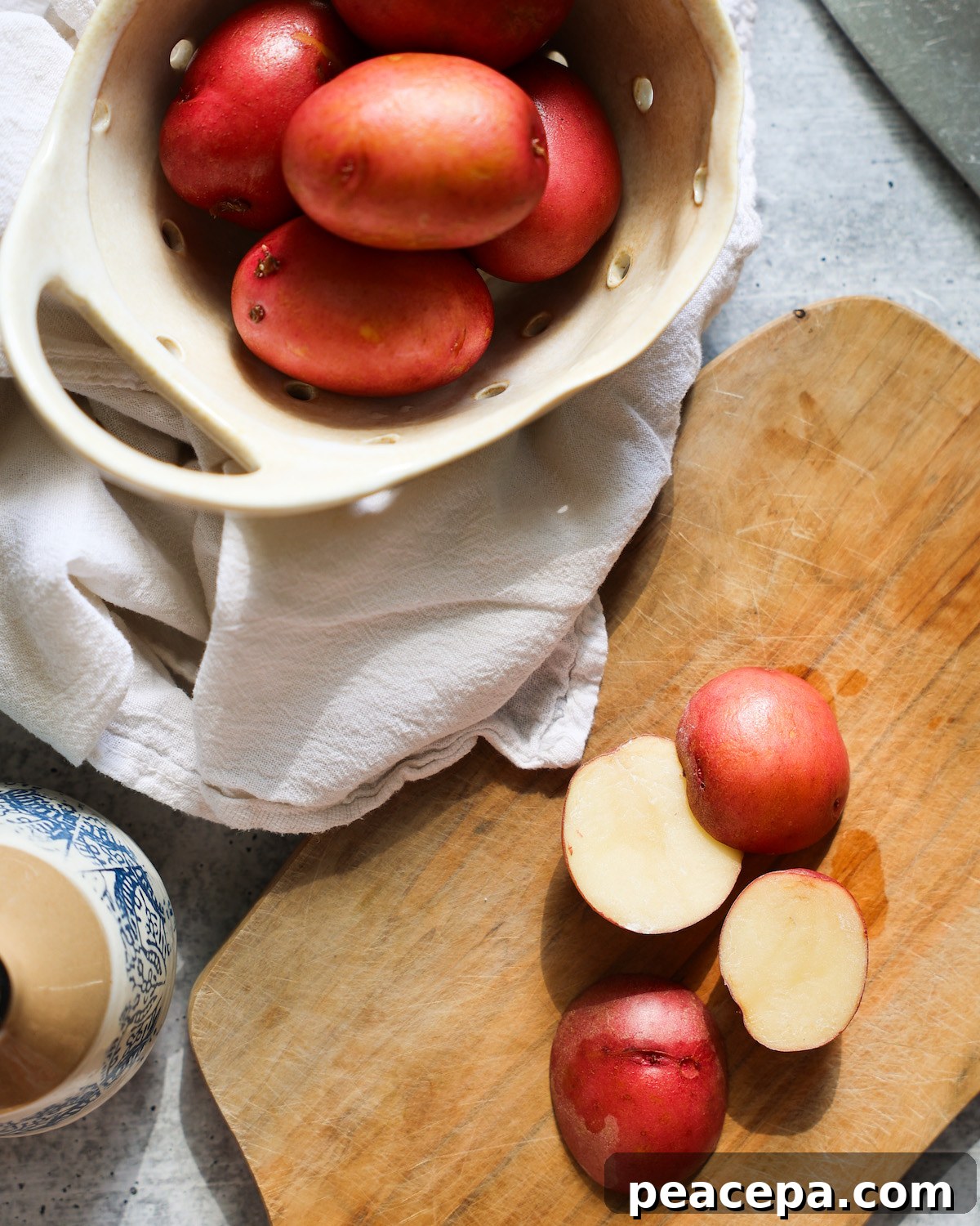 red potatoes on cutting board