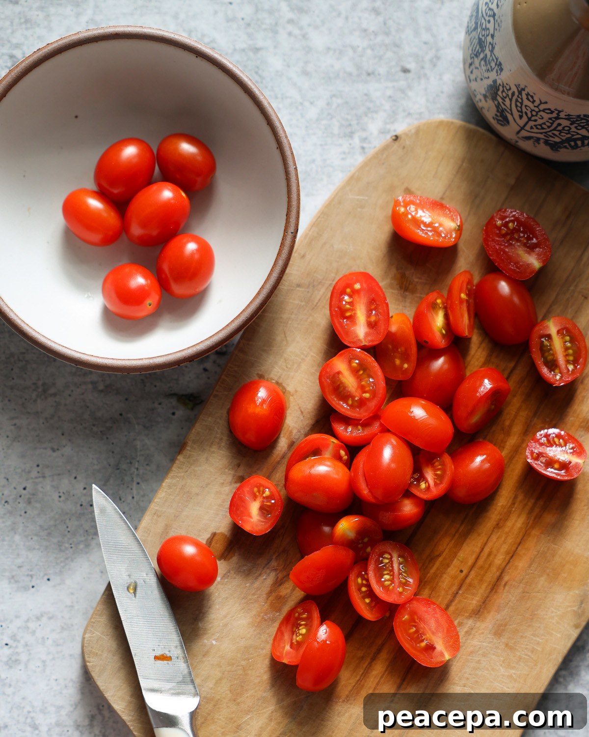 slicing tomatoes on wooden cutting board