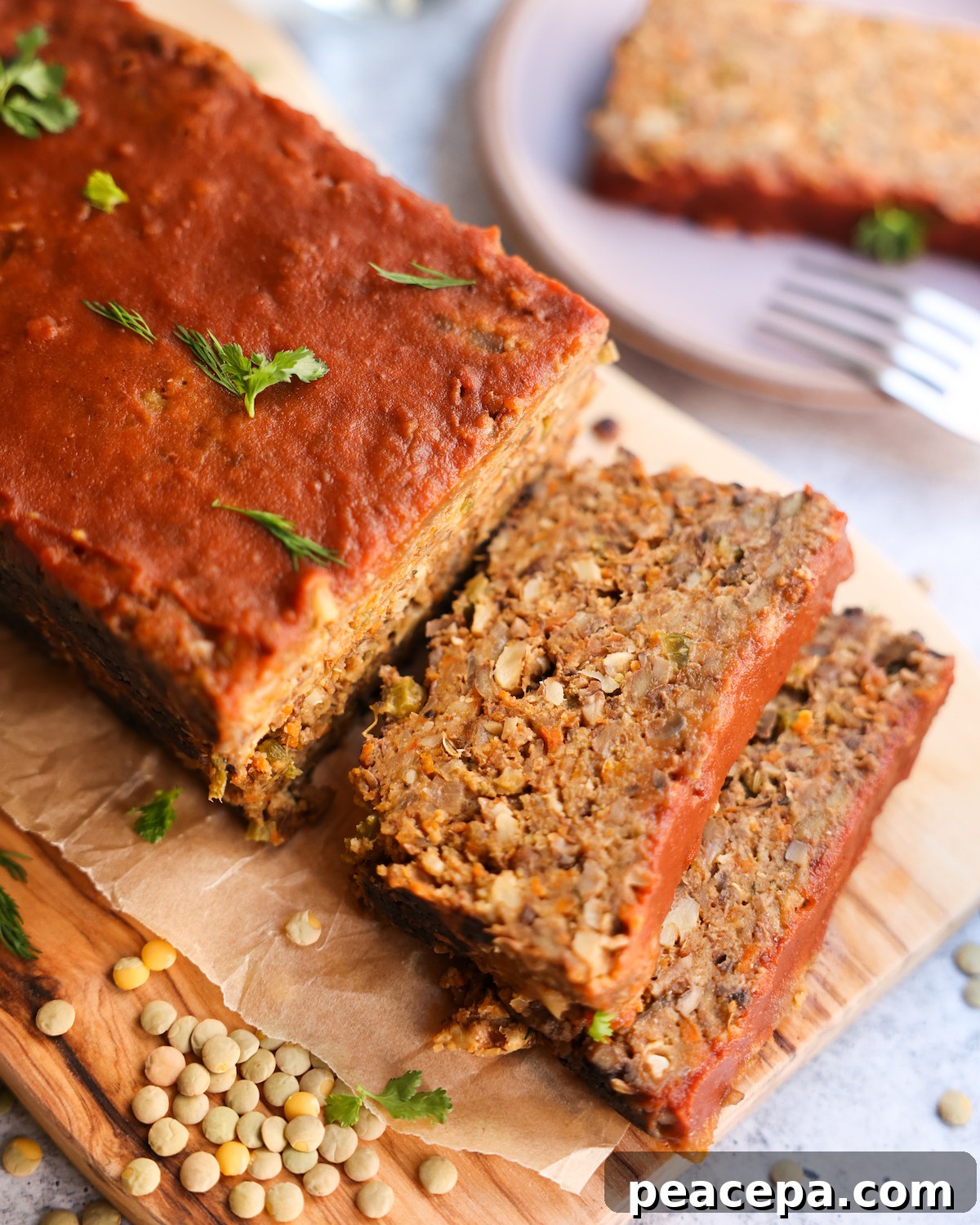 vegan meatloaf sliced on wooden tray