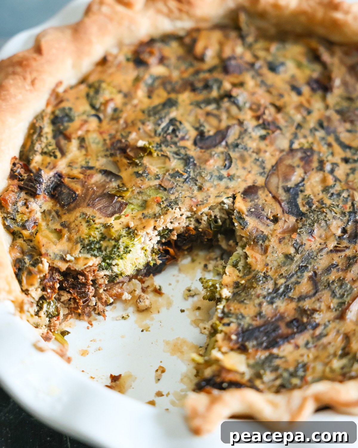 Vegan quiche with missing slice.