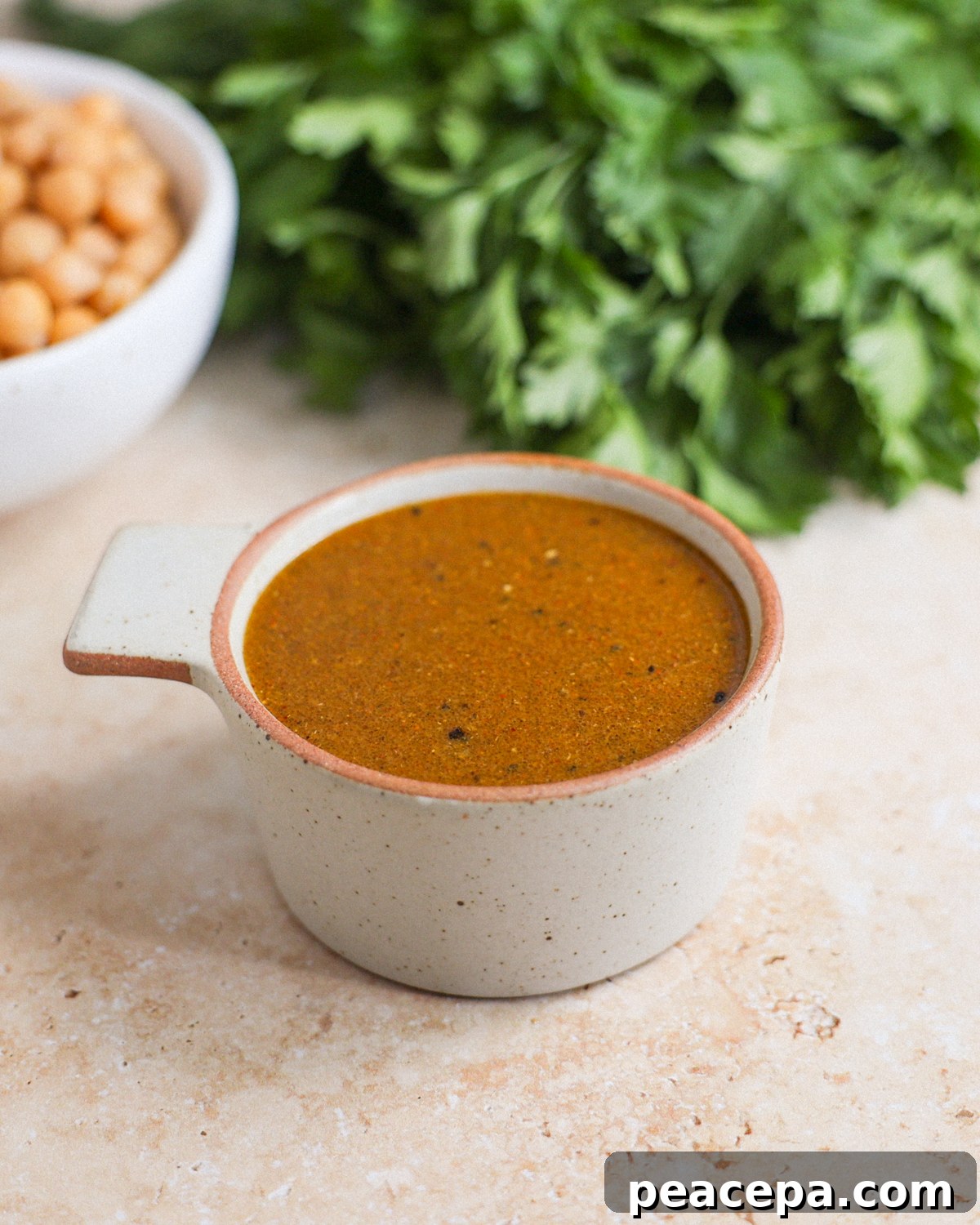 curry vinaigrette in measuring cup