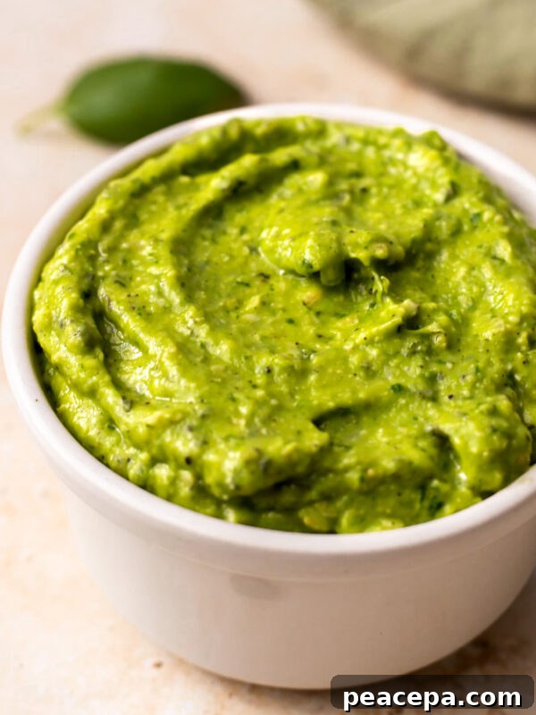 Creamy Homemade Guacamole Recipe for Parties and Dips 11 close up of avocado dressing in a bowl