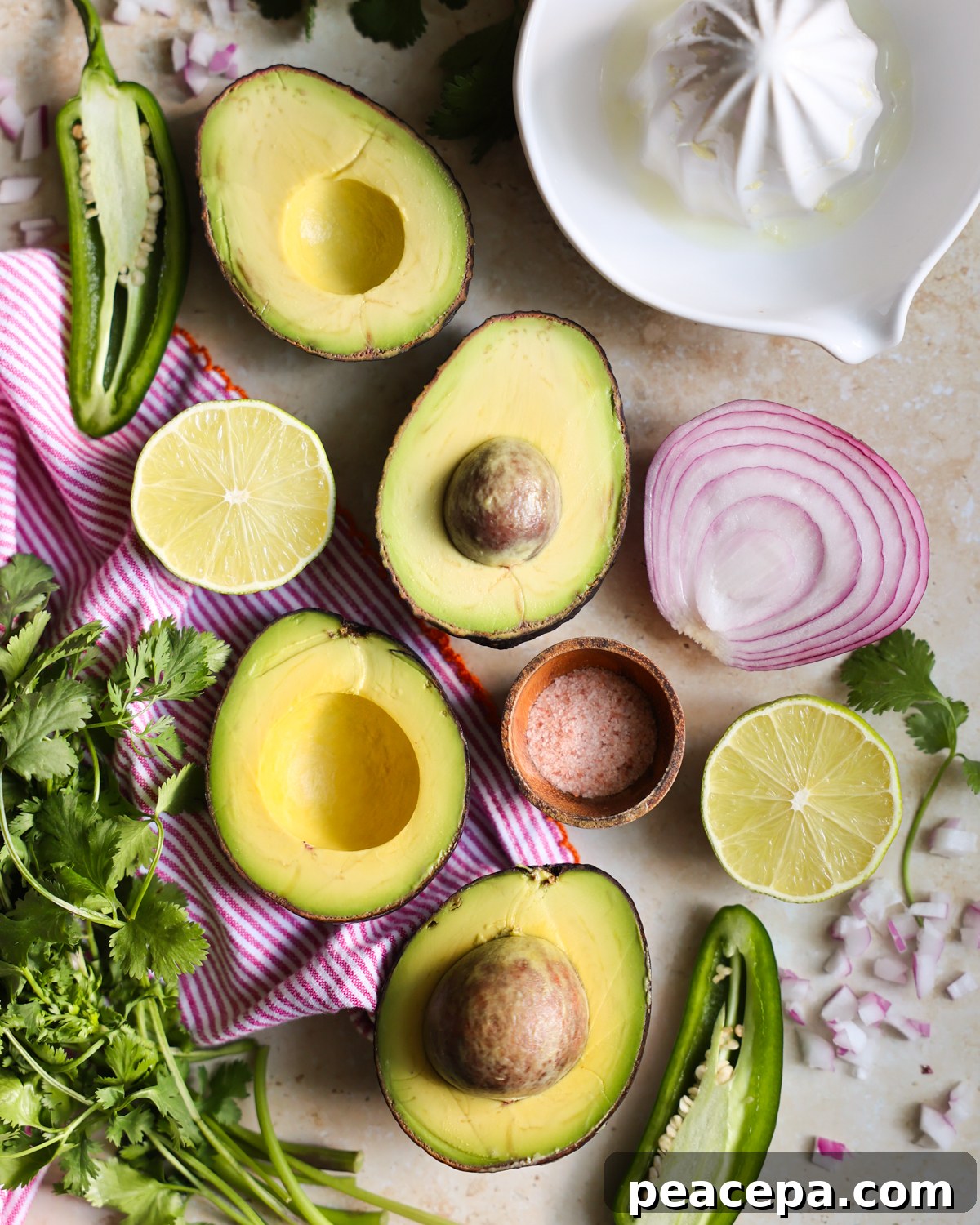 Creamy Homemade Guacamole Recipe for Parties and Dips 3 Guacamole ingredients on the counter.